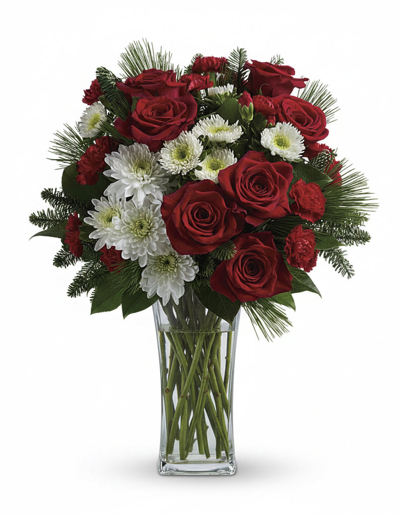 Bouquet of red roses and white flowers in a clear vase on a white background